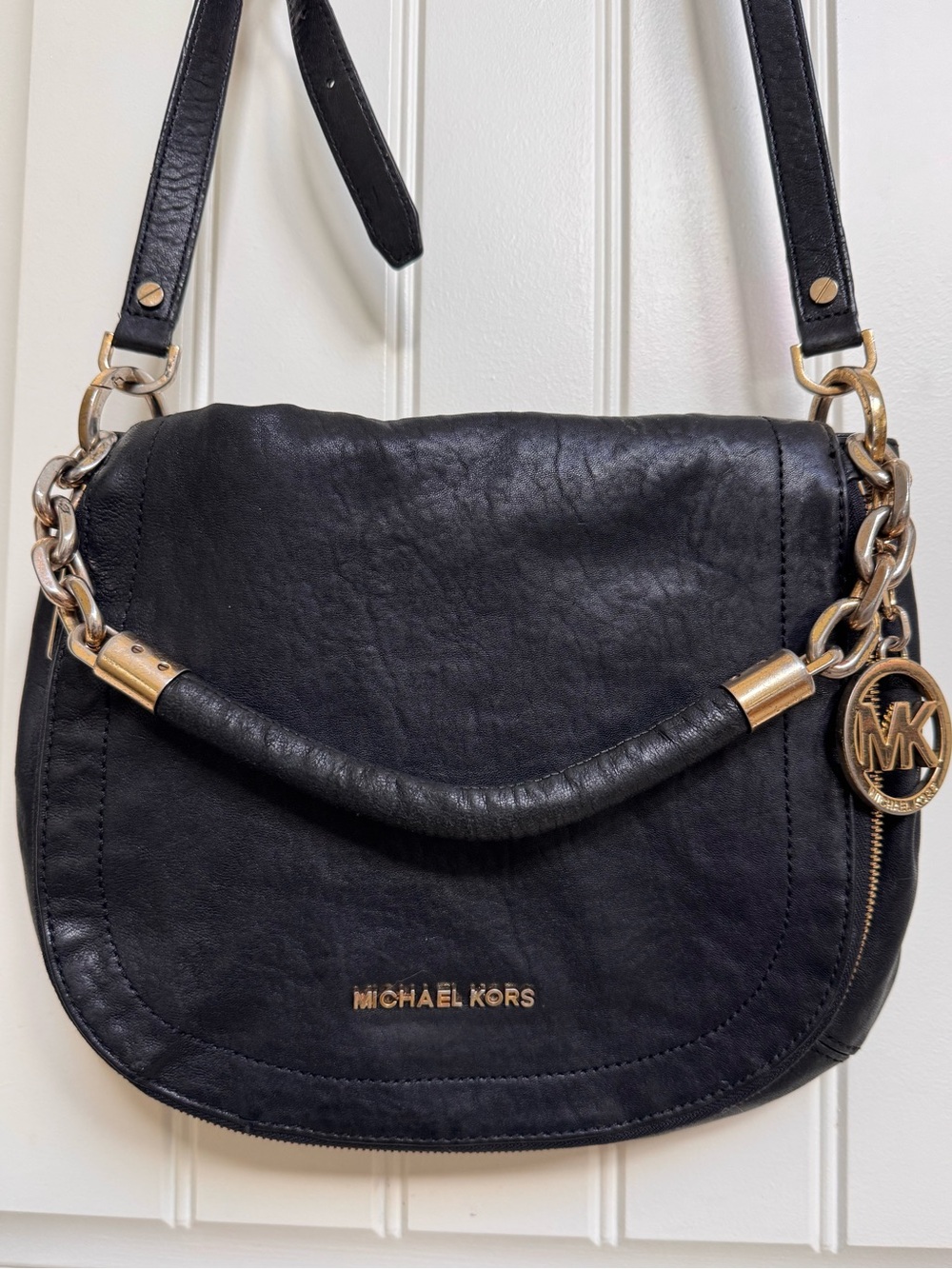 Michael Kors Bedford Flap Black Leather shoulder bag. 12” by 10” by 1”